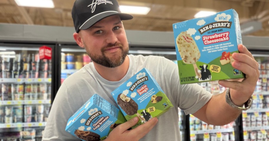 man holding up boxes of Ben & Jerry's Ice Cream Bar 4-Packs