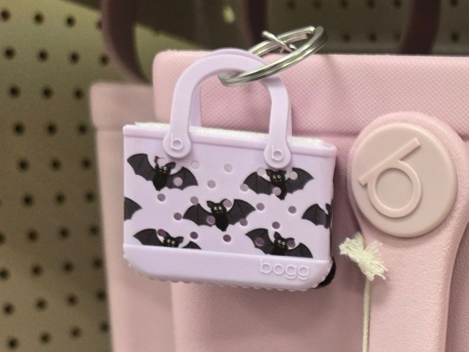 Bogg Bag Tiny Tote Keychain - Let's Get Batty clipped to bag in store