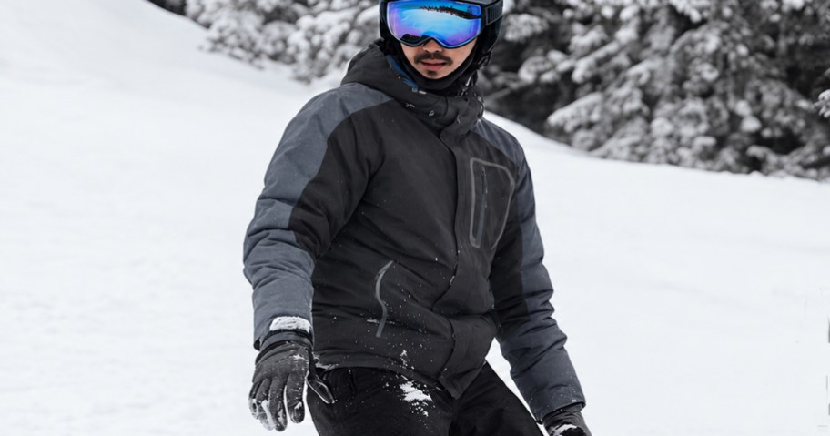 man skiing wearing a black and grey winter jacket