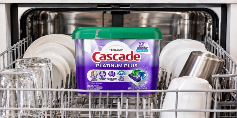Container of Cascade Platinum Plus in the top rack of a dishwasher.