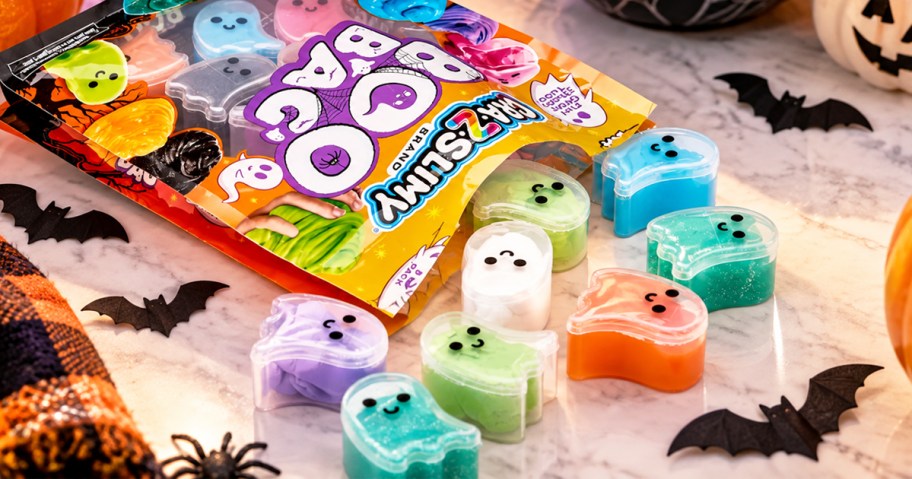 colorful ghost shaped slime containers coming out from their bag on a table