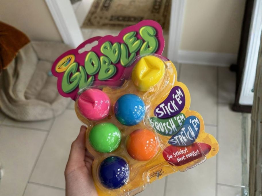 hand holding Crayola Globbles Fidget Toy 6-Pack