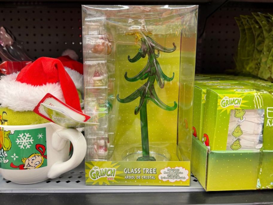Dr. Seuss Grinch 8" Glass Christmas Tree on shelf in store