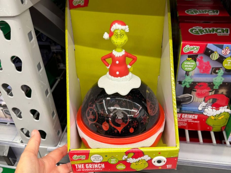 Dr. Seuss The Grinch Christmas Tabletop Shadow Lights Projector in hand in store