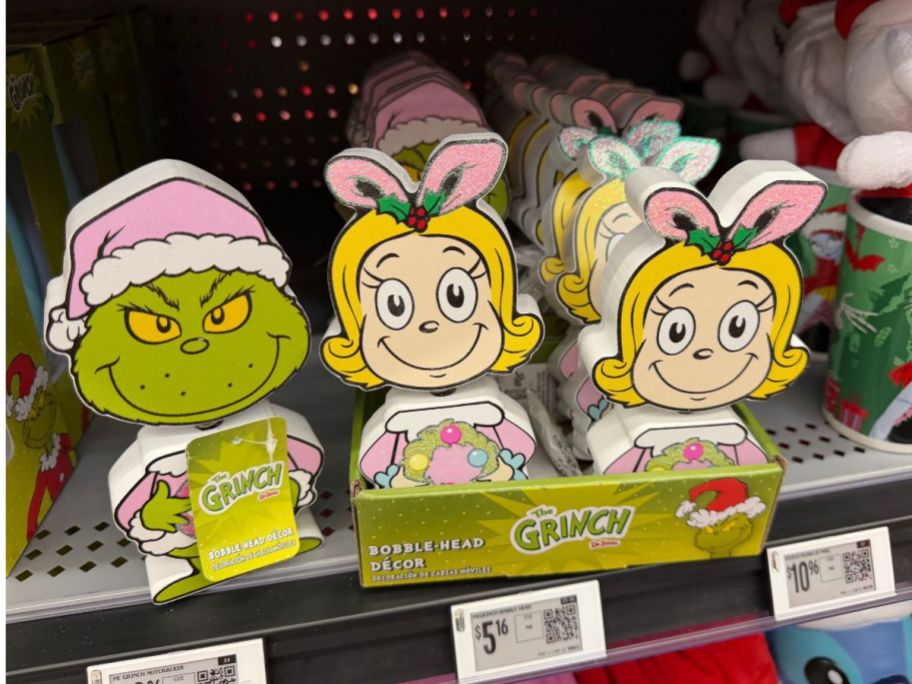 Dr. Seuss Wooden Bobble Head Figurines on shelf in store