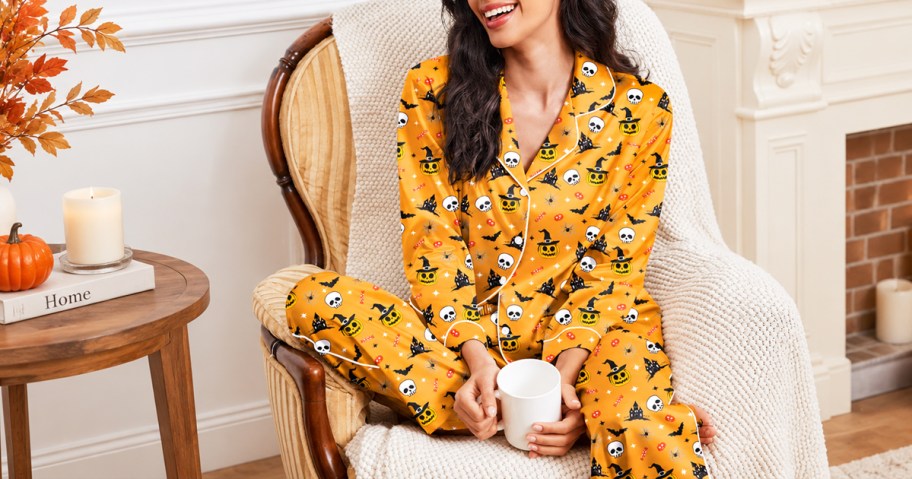 woman wearing a pair of orange halloween print pajamas