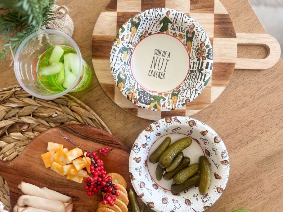 Elf plates and cups with food inside of it
