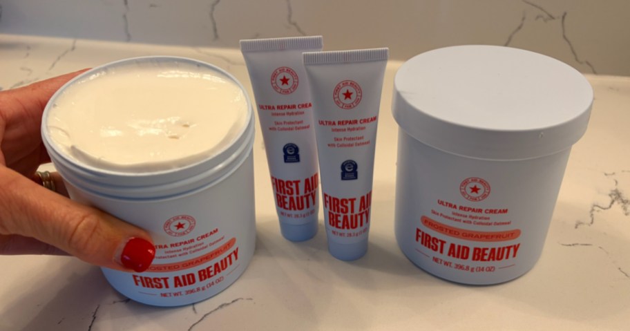 Four piece first day beauty skincare set displayed on bathroom countertop