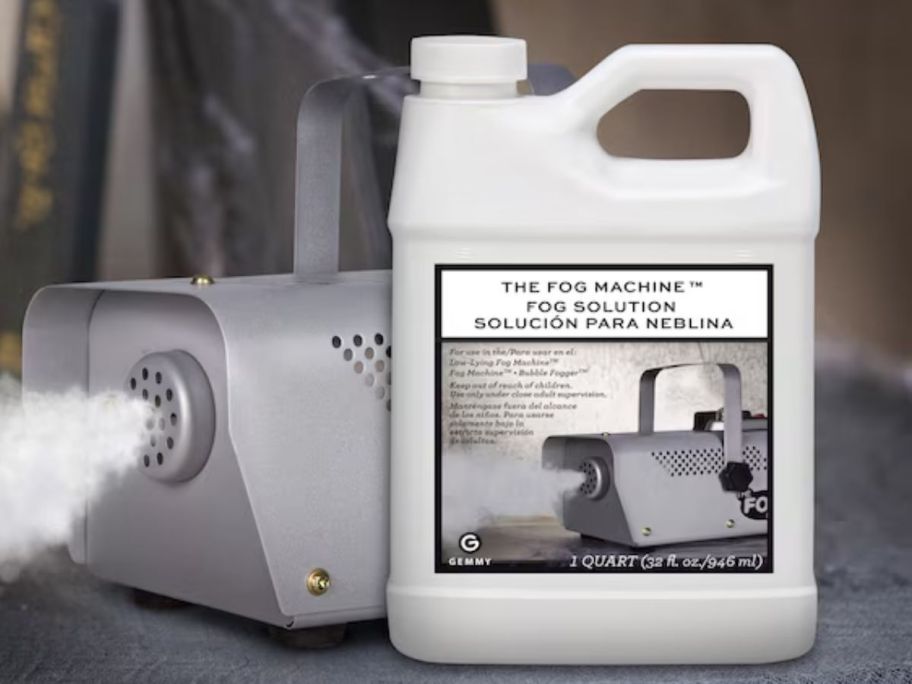 Fog solution next to a fog machine on the floor