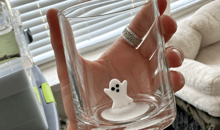 hand holding a ghost glass 