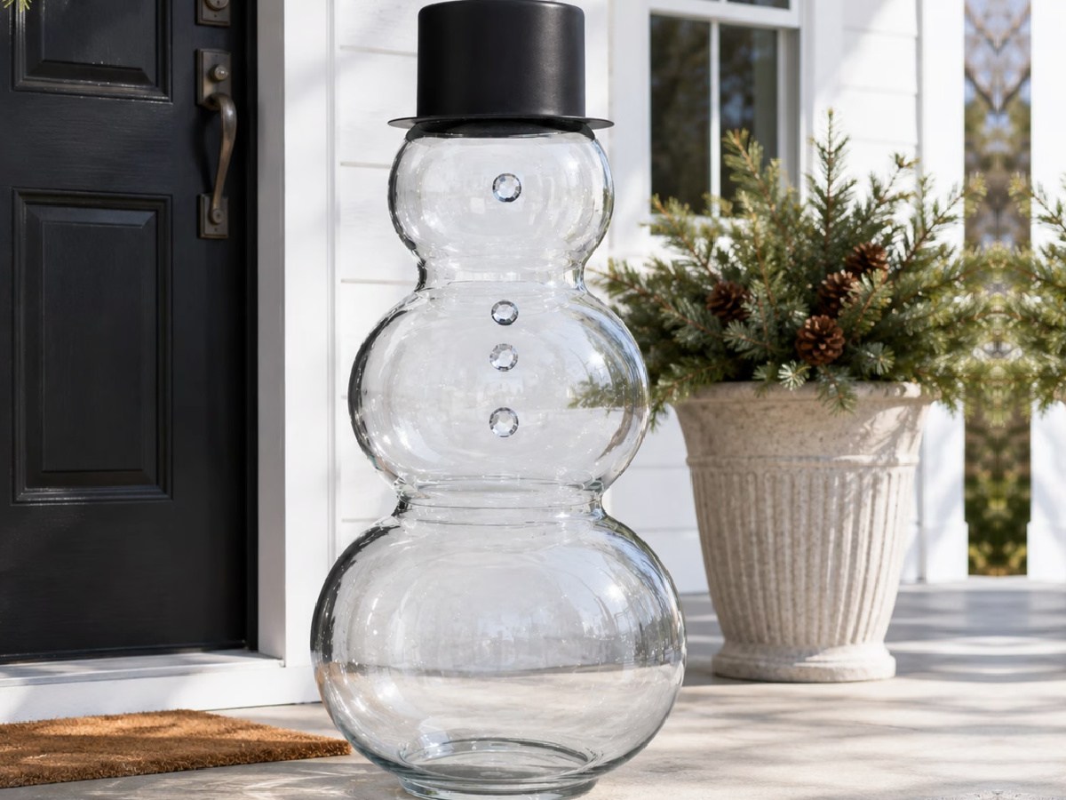 large glass snowman on front porch