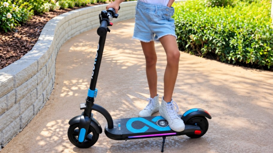 a little girl on a scooter