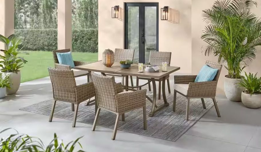 Hampton Bay Holly Cove 7-Piece Wicker Outdoor Dining Set on a patio