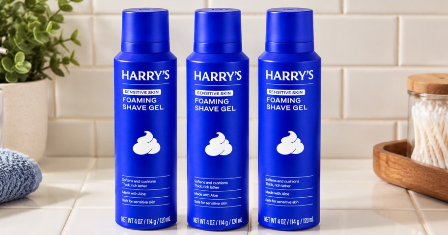 three blue bottles of Harry's Foaming Shave Gel on a bathroom counter