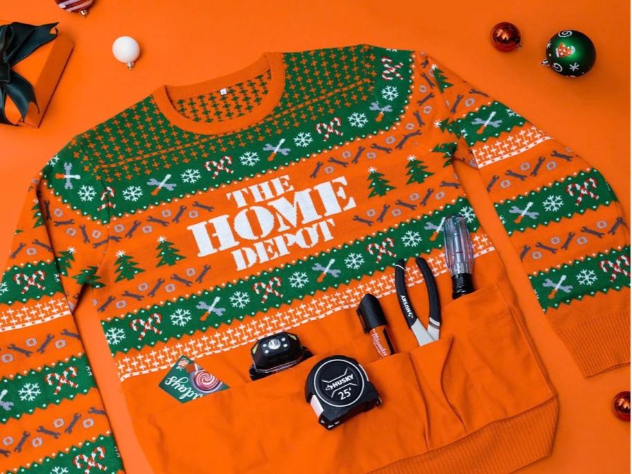 Home Depot Holiday Sweater with Tools and $50 Gift Card against orange background