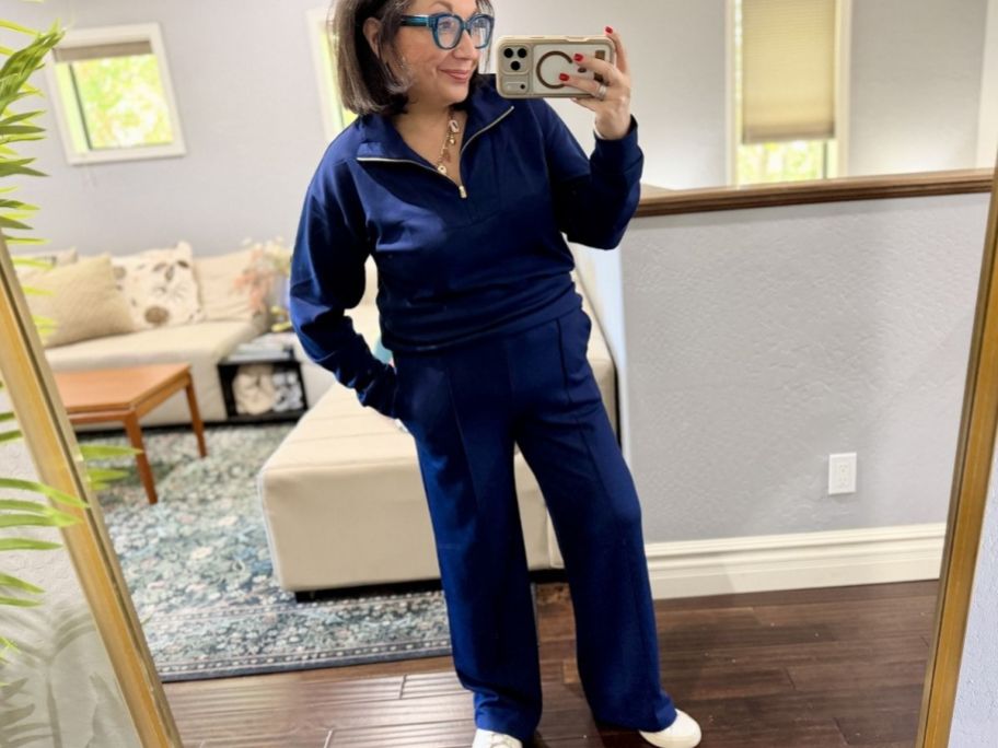 Woman wearing Jcrew navy sweater and pants