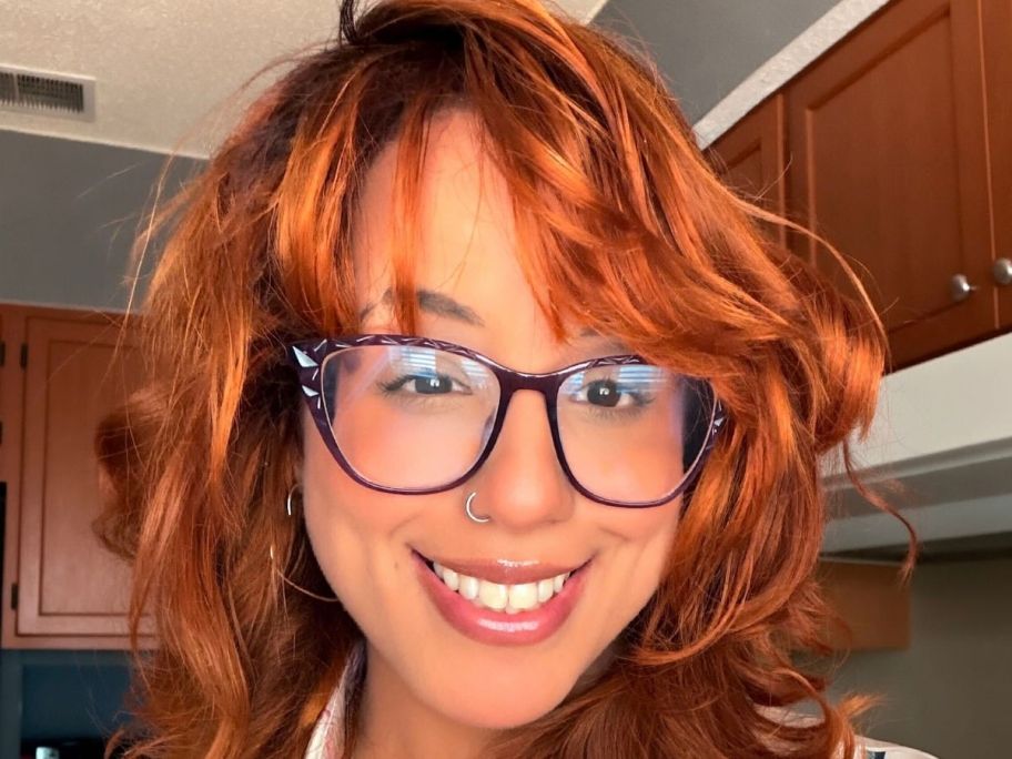 Woman with copper hair smiling
