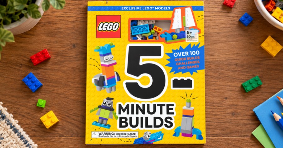 LEGO 5-Minute Builds Book on a table with lego bricks around it