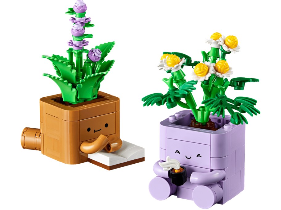 lego plant figurines reading a book and drinking coffee