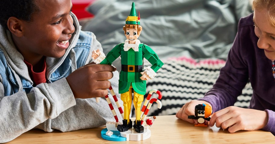 two kids playing with LEGO Buddy the Elf set