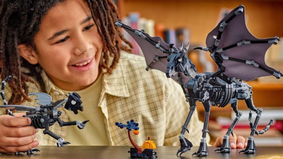 LEGO Harry Potter set on top of the table with child playing