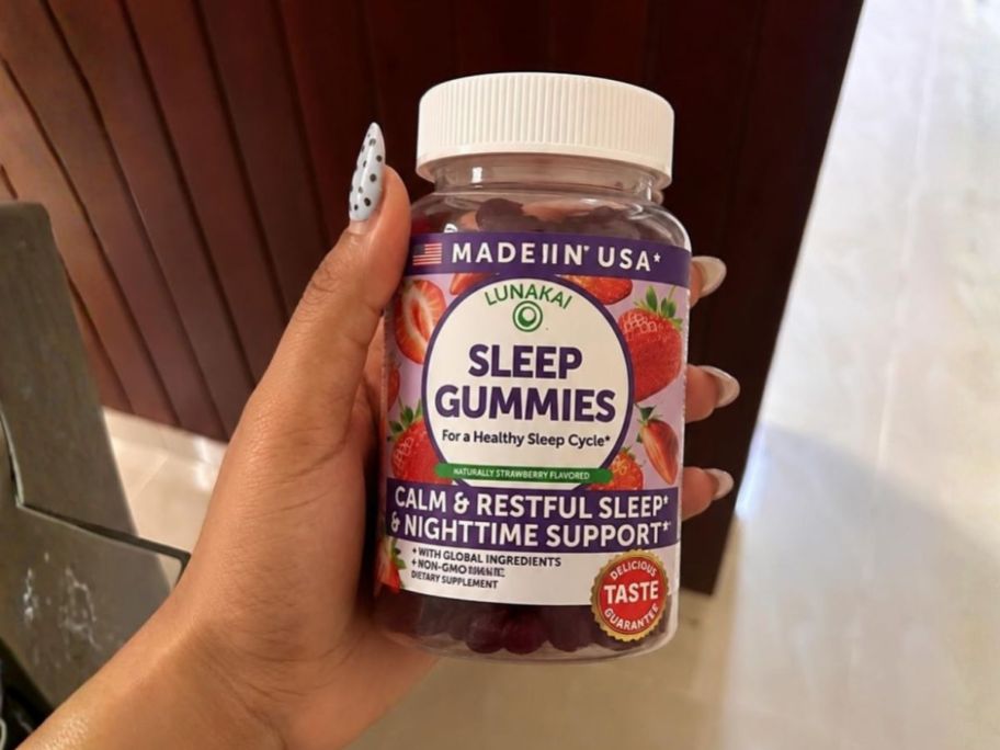 Lunakai Sleep Gummies 60-Count bottle in hand