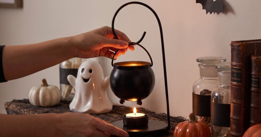 Metal Cauldron Tealight Warmer on a table with other Halloween Decor