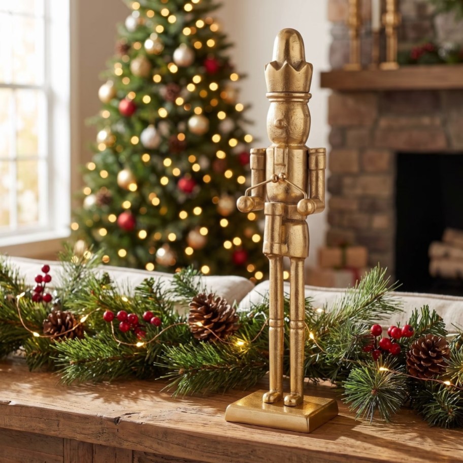 a gold metal nutcracker on a tabletop