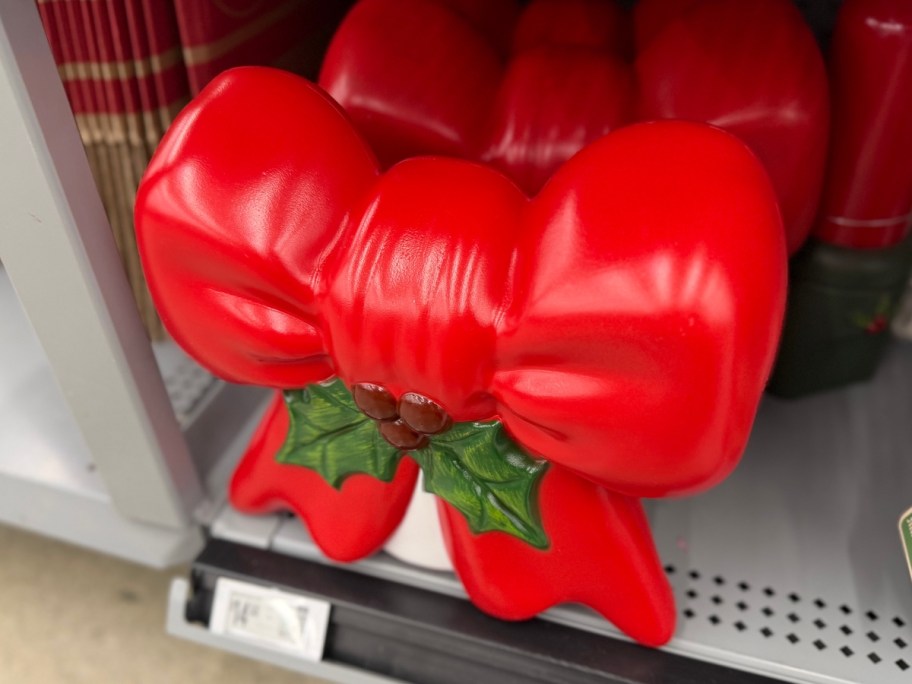 red blow mold bow decoration on gray store shelf