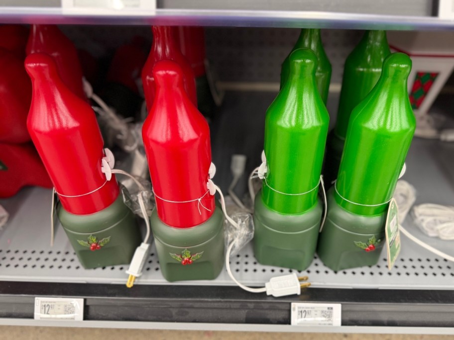 christmas light blow molds on a gray shelf