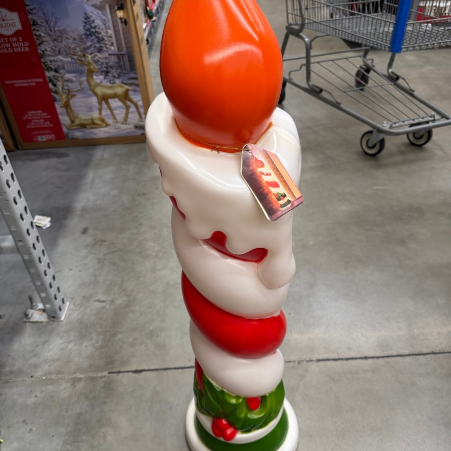 large blow mold candle on Walmart floor