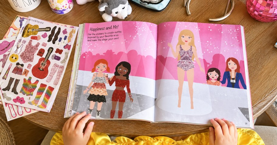 swiftie themed activity book on a table with stickers