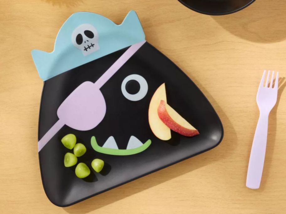 Pillowfort Pirate Plate with food on it on table