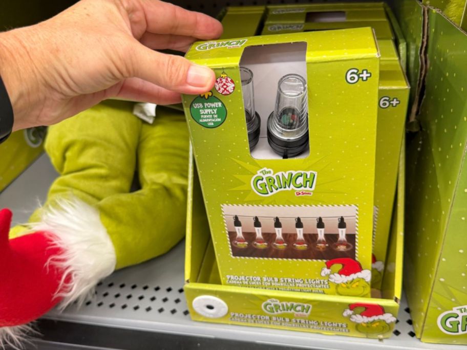 Ruz Dr. Seuss Grinch Projector Bulb String Lights in hand in store