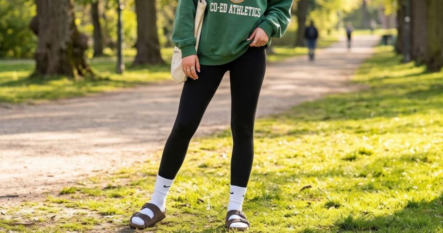 woman wearing sinophant leggings with an oversized sweatshirt
