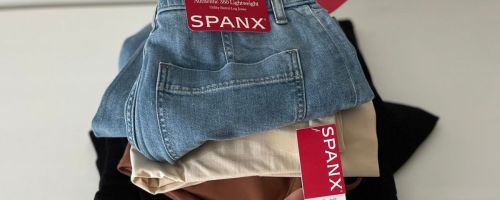 A stack of Spanx clothing new with tags