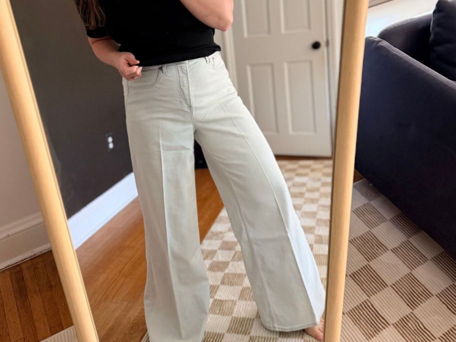 Woman wearing Spanx Wide Leg Jeans in a mirror