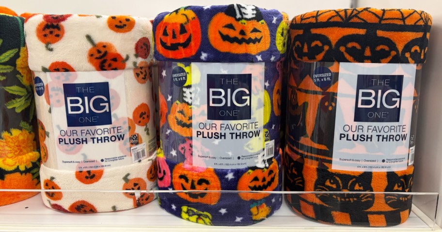 pumpkin print blankets on a store shelf