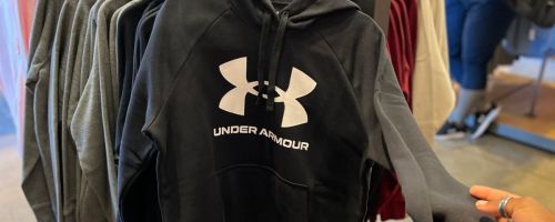 Black Under Armour Hoodies on a rack