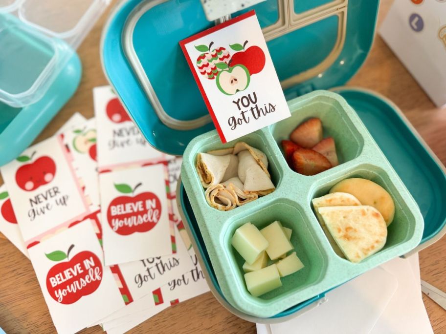 A bento lunch box with Walgreens Classroom Cards