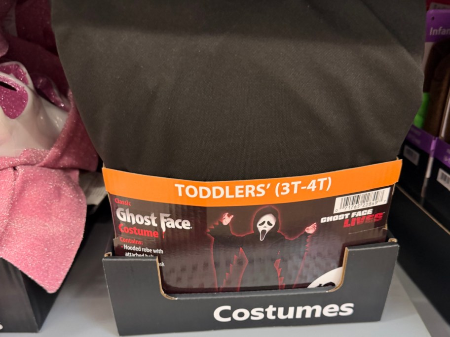 A toddler-sized classic Ghost Face costume box on a store shelf.