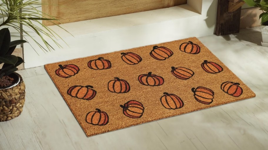 coir doormat with orange pumpkin motif