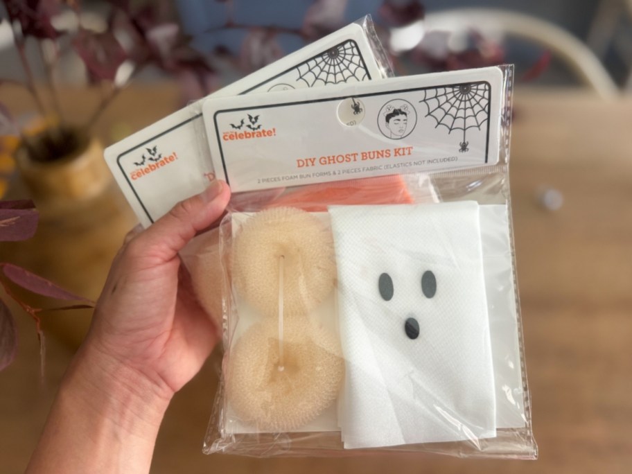 hand holding 2 halloween hair buns kits