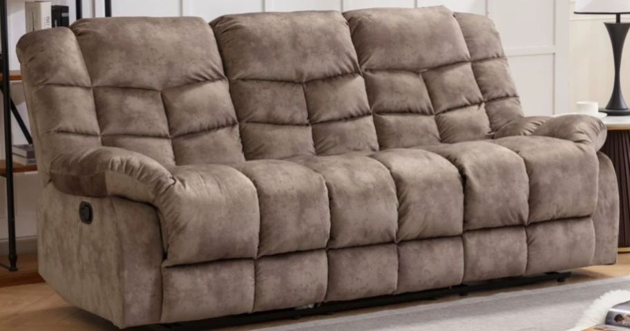 A tan recliner sofa in a living room