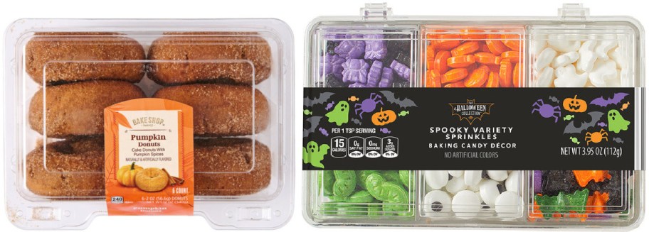 A plastic container of Bake Shop pumpkin donuts on the left, alongside a compartmented container of Halloween variety sprinkles and baking candy decor on the right.