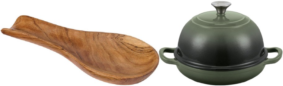 A carved wooden spoon rest on the left, alongside an olive green enameled cast iron Dutch oven with a domed lid and side handles on the right.