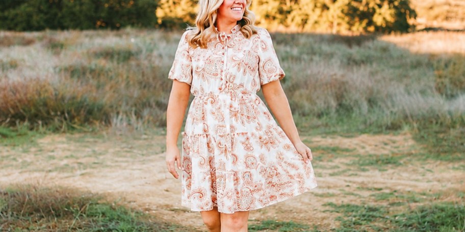 woman wearing brown and white floral dress