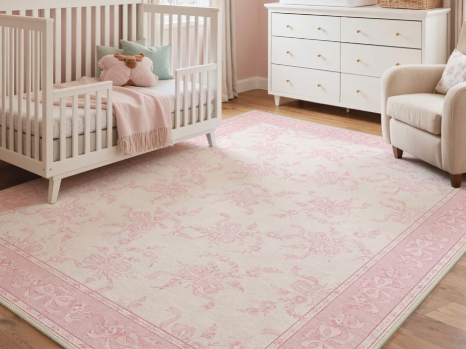 pink bow rug in babys room