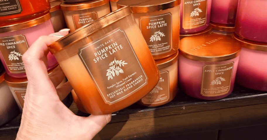 hand holding fall candles at bath & body works