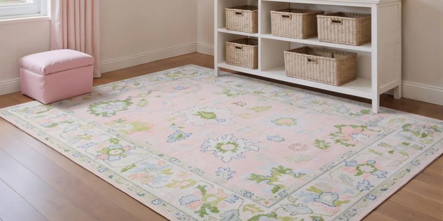 pink and green floral rug in bedroom
